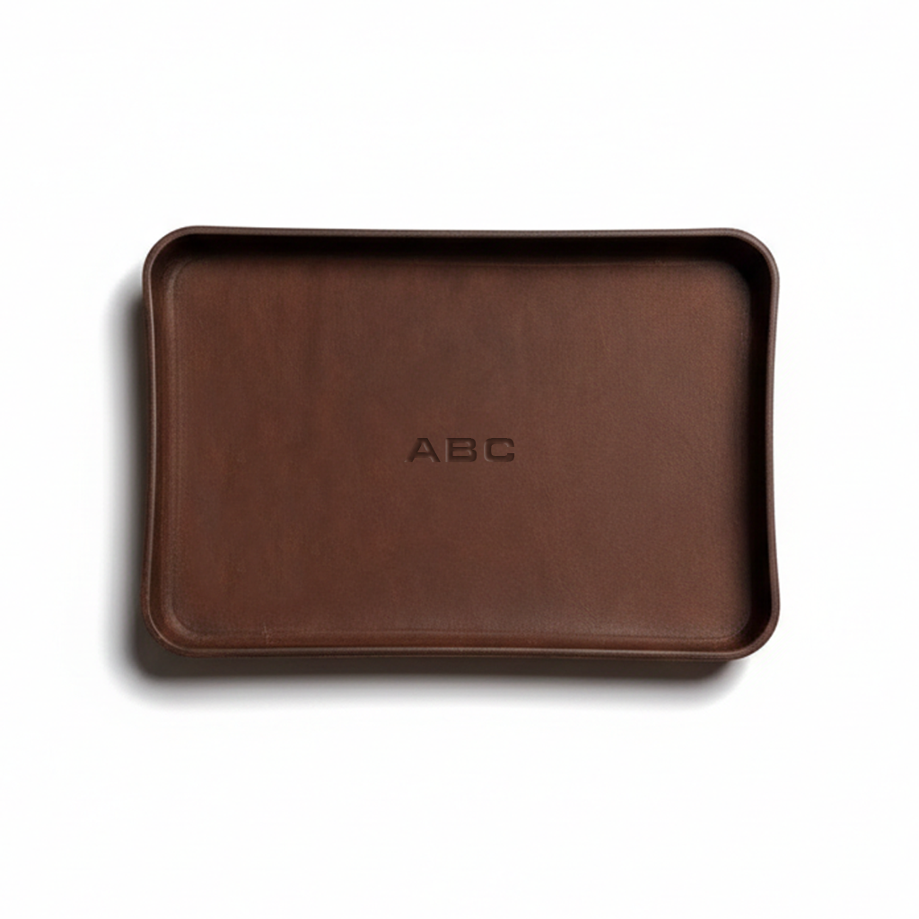 Brown tray with 'ABC' engraving on a white background